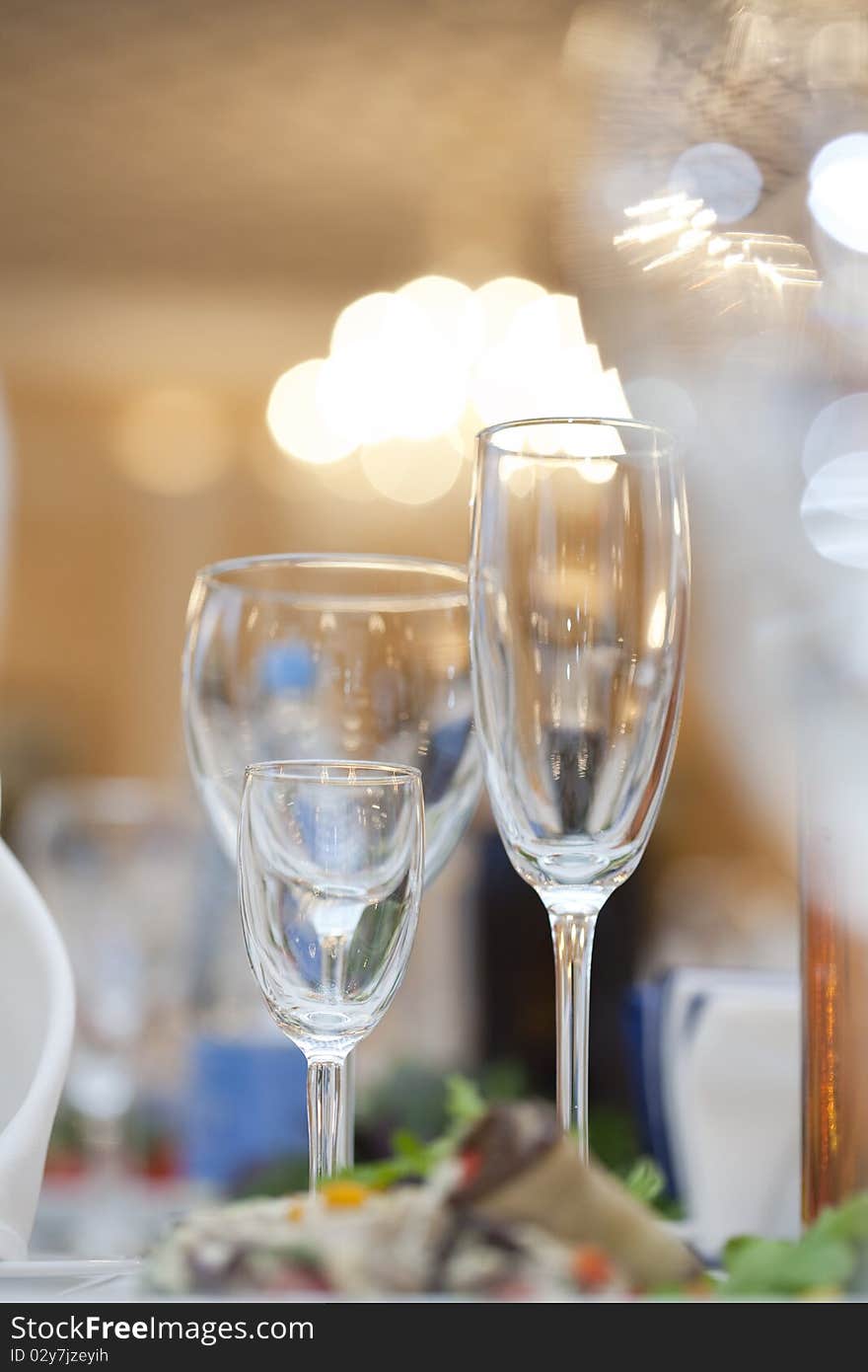 Three wine glasses  on fancy table set