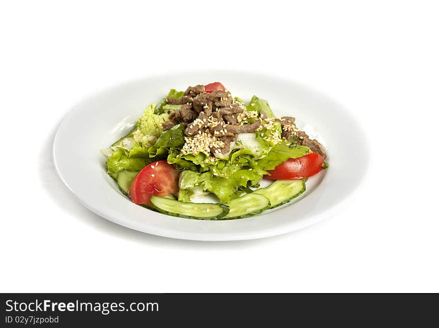 Sesame Beef  with Vegetables on a white ceramic plate