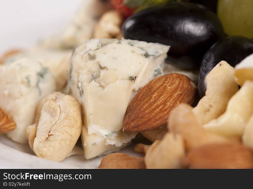 Close up of cheese plate with grapes and nuts