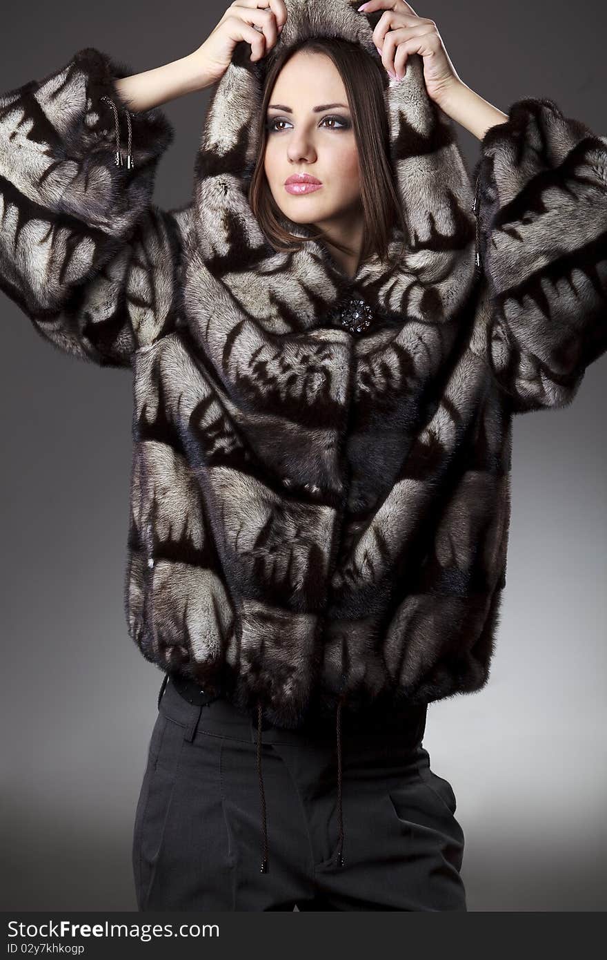 Woman in fur jacket with hood