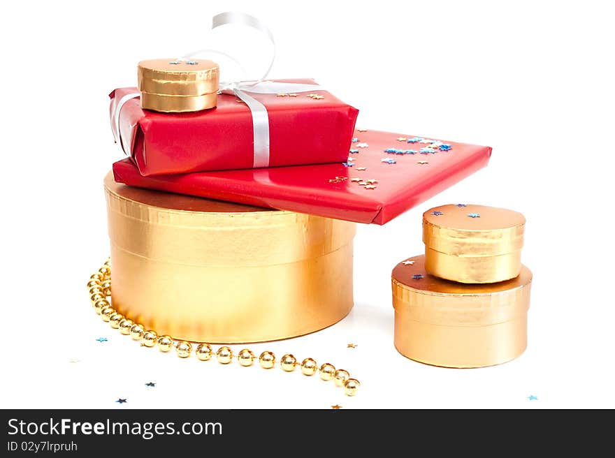 Red and gold gift boxes isolated on a white background. Red and gold gift boxes isolated on a white background.