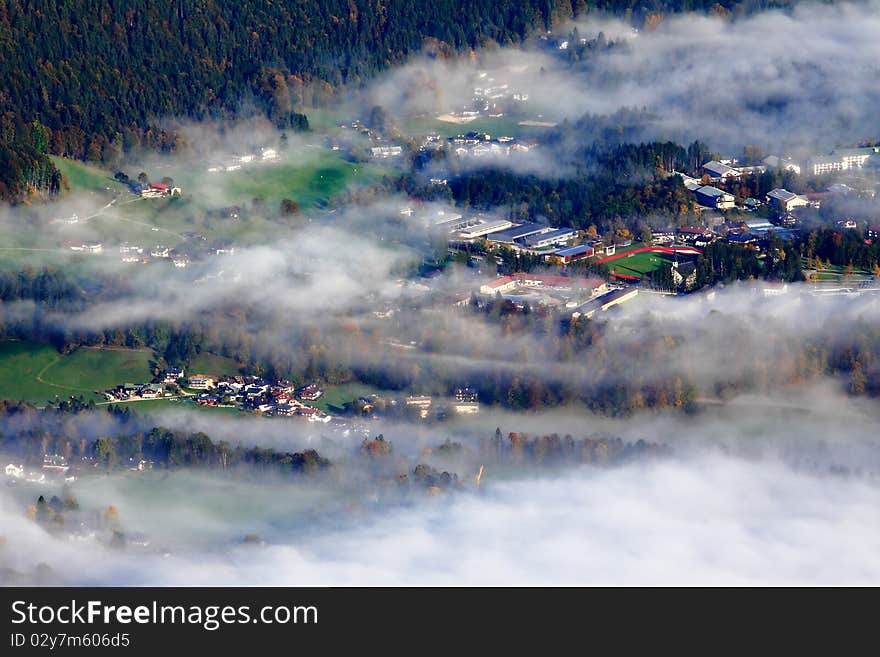 Village covered by fog in the morning, distant photograph from the mountain