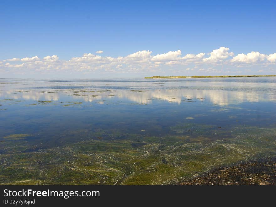 Multi-coloured majestic landscape with sky and water. Multi-coloured majestic landscape with sky and water