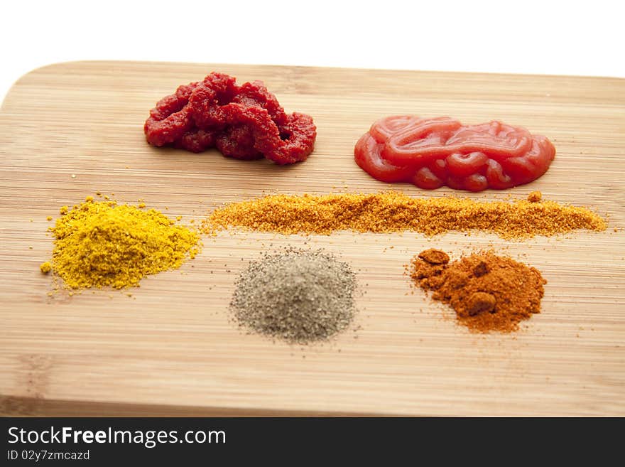 Spices with ketchup and tomato marks