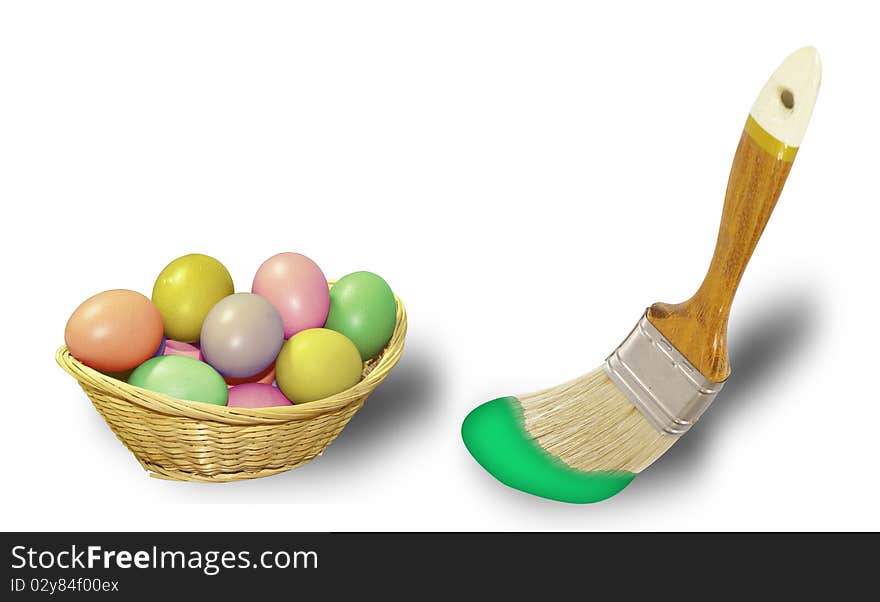 This image shows a colored eggs in a wicker basket and a brush with paint. This image shows a colored eggs in a wicker basket and a brush with paint