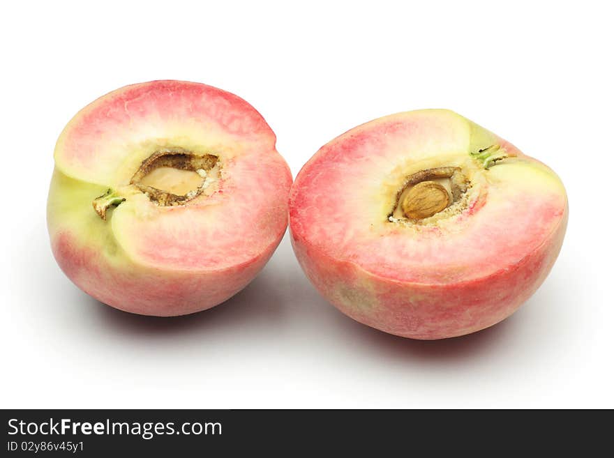 Cut peaches on white background