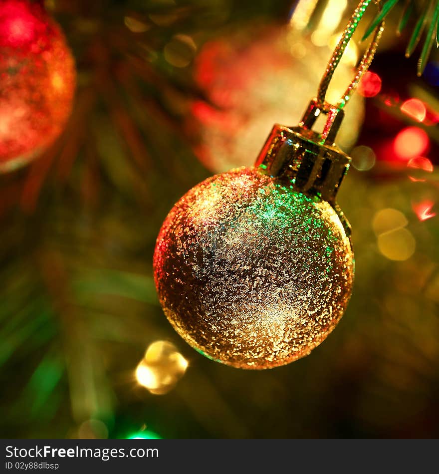 Close-up photo with decorations of christmas tree. Selective focus (Narrow depth of field). Square crop. Close-up photo with decorations of christmas tree. Selective focus (Narrow depth of field). Square crop.