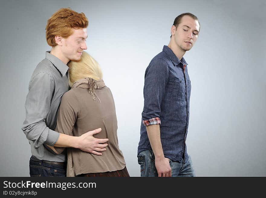 White teens in conflict for blonde girl smiling. White teens in conflict for blonde girl smiling