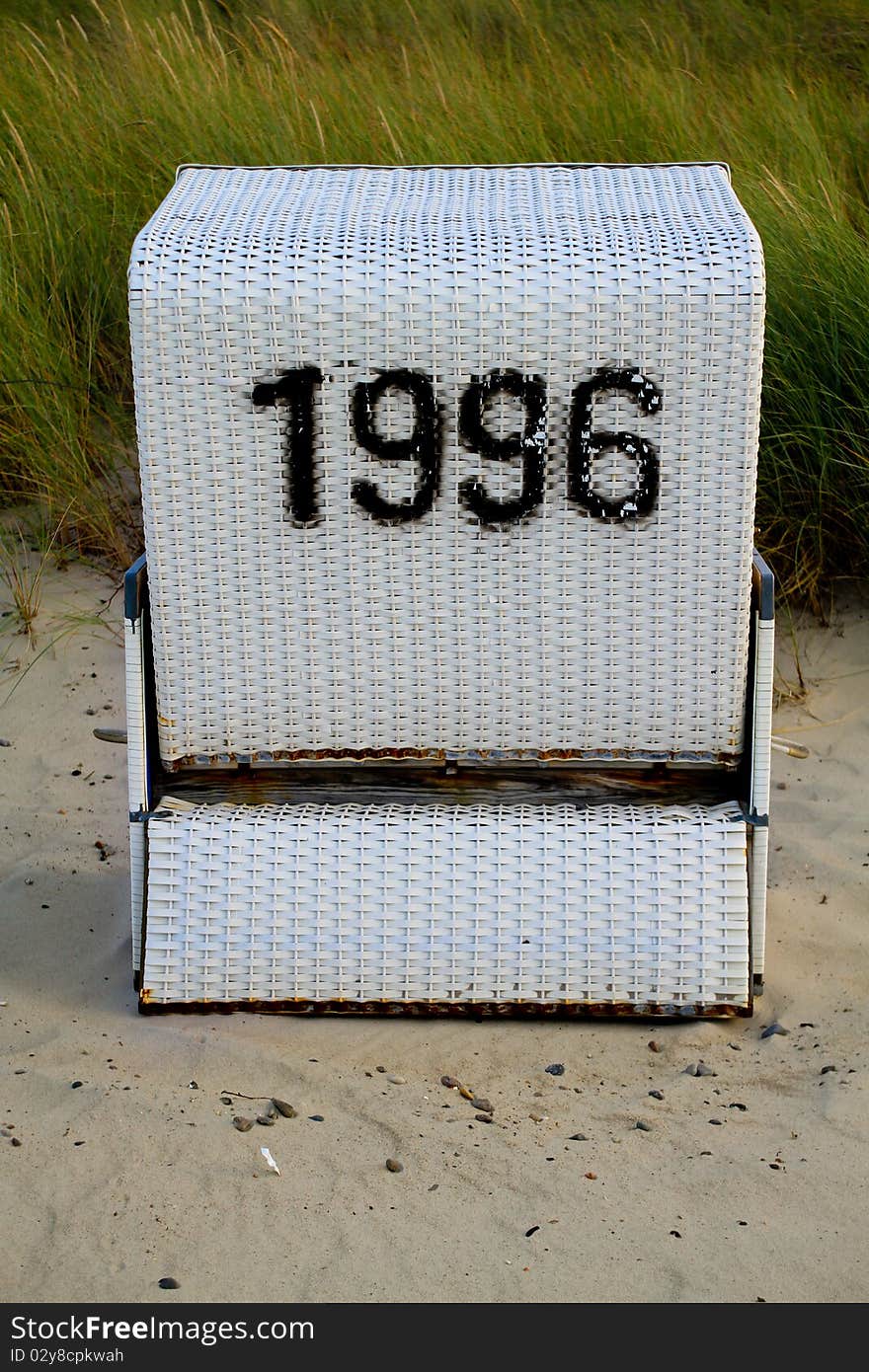 Hooded beach chair with number 1996 on german beach