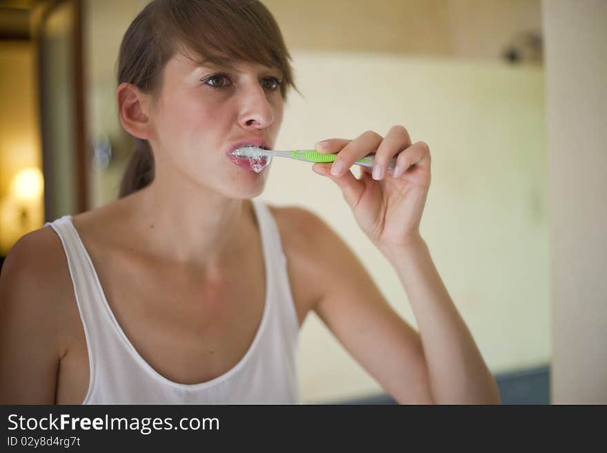 Woman Cleaning Teeth