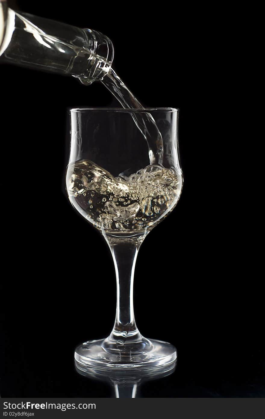 White wine being poured into a wine glass