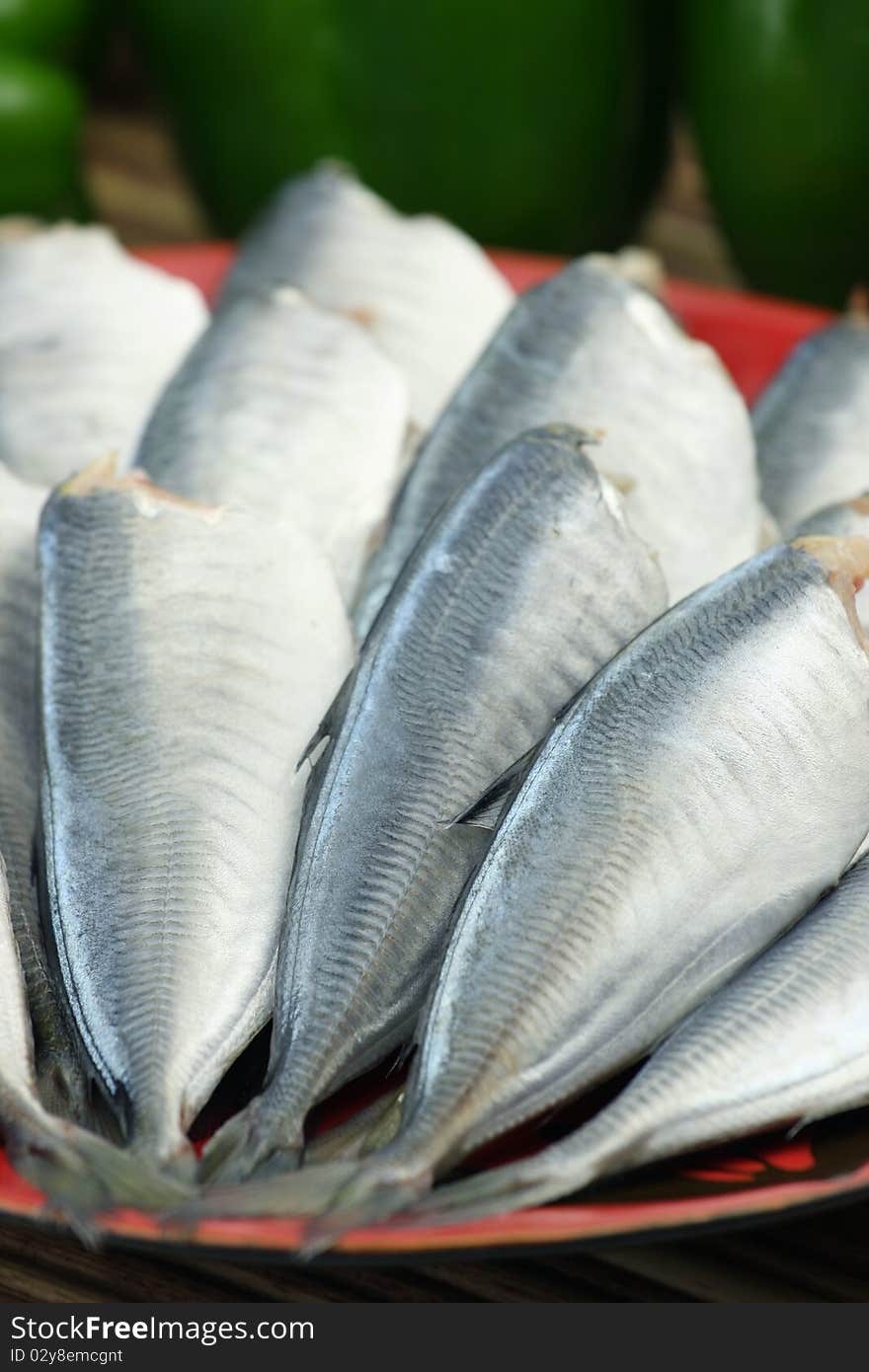 A dish of fresh fishes on white