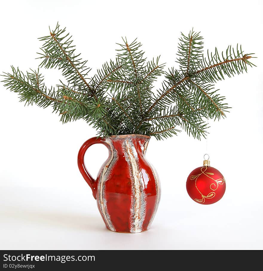 Christmas decoration in colored glass vase on white background