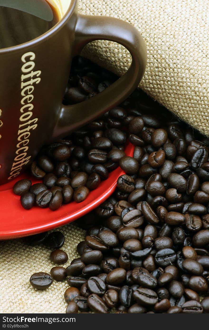 Cup of coffee sitting in a bed of coffee beans