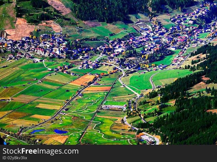 Village and fields at the foot of Peak of Zugspitze