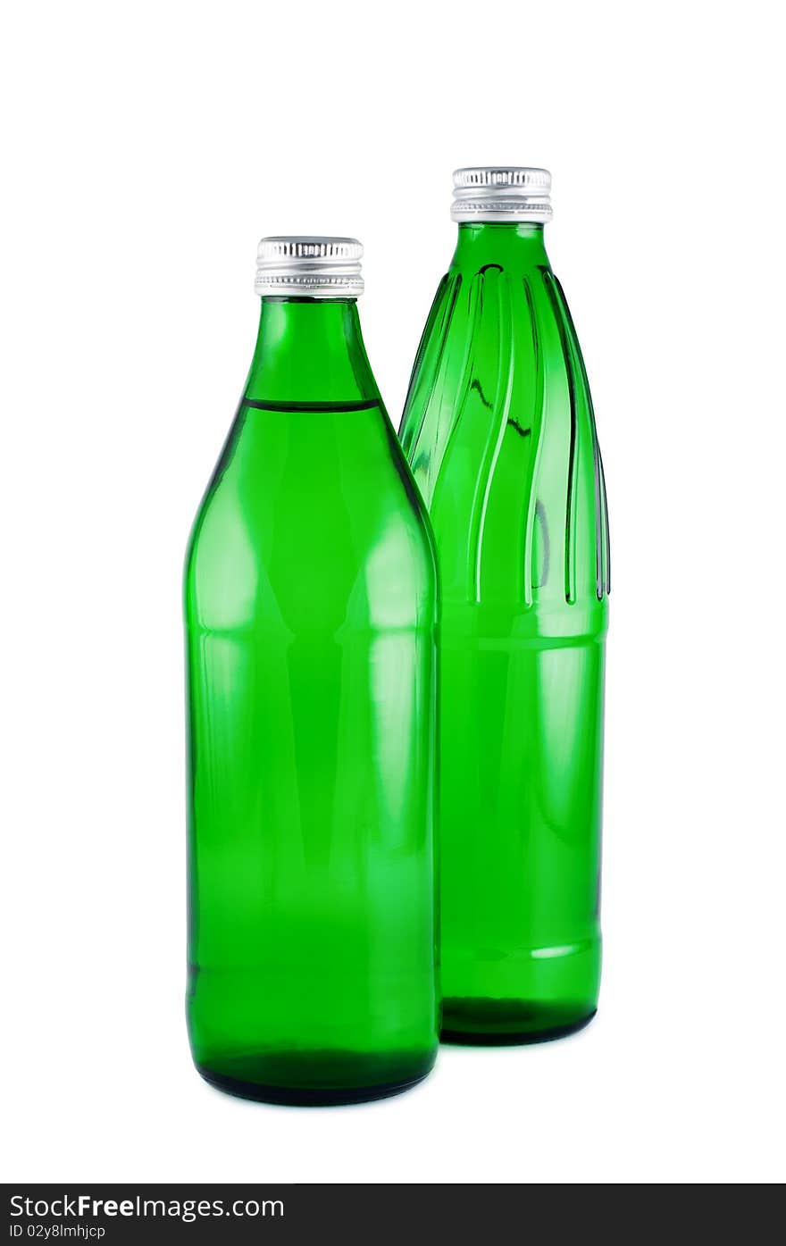 Water in bottles isolated white. Clipping path. Water in bottles isolated white. Clipping path.