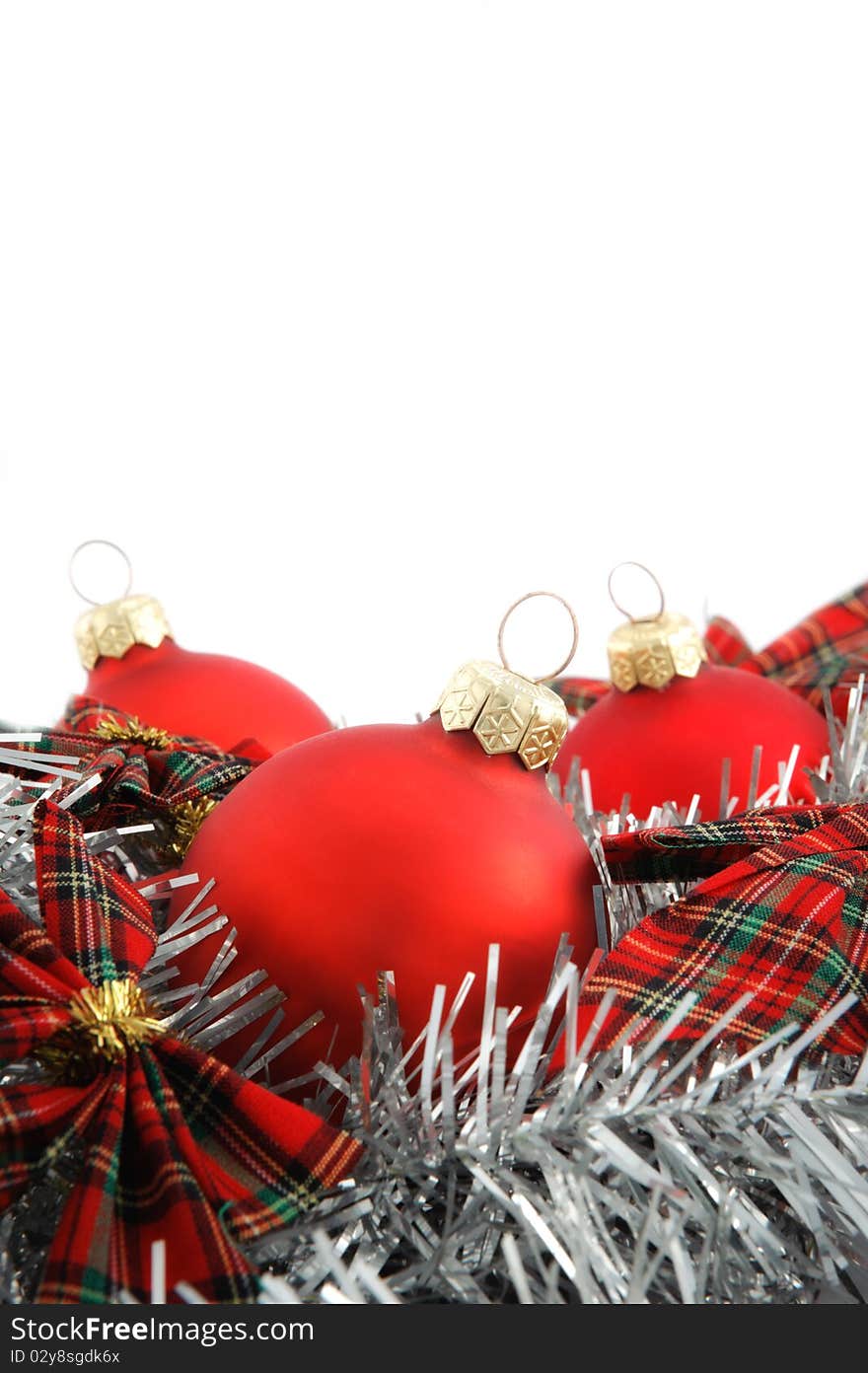 Three red Christmas balls with silver decoration on white background. Three red Christmas balls with silver decoration on white background