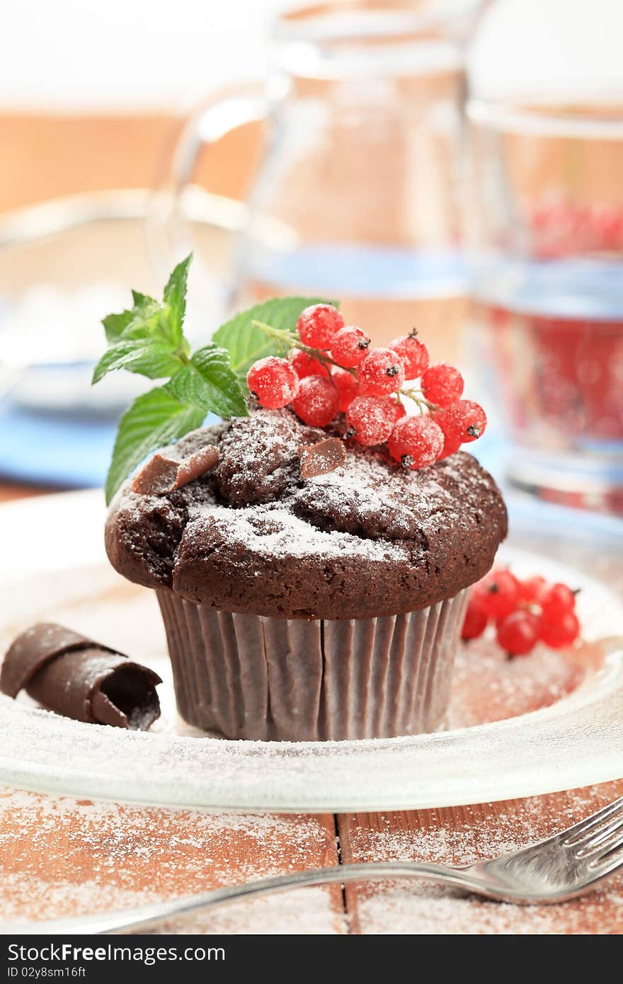 Chocolate muffin styled with red currant - detail