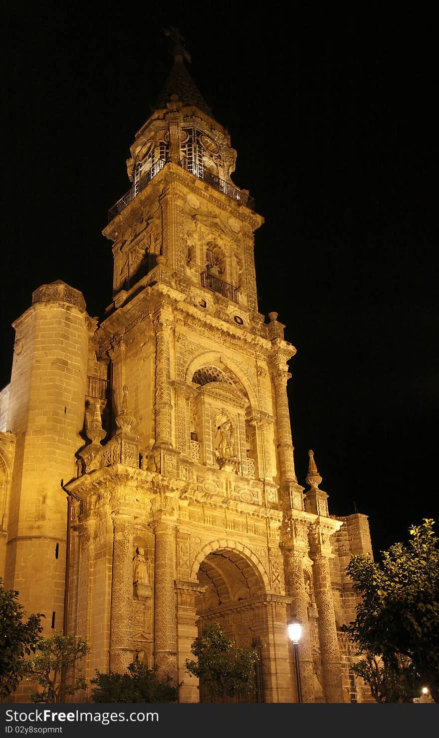 The night view of St. Miguel church, built in gothic-baroque style, in Jerez de la Frontera, Spain. The night view of St. Miguel church, built in gothic-baroque style, in Jerez de la Frontera, Spain.