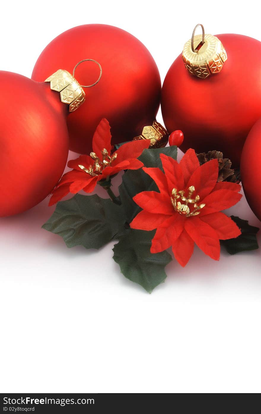 Four red Christmacs balls with flower decoration close up on white background. Four red Christmacs balls with flower decoration close up on white background