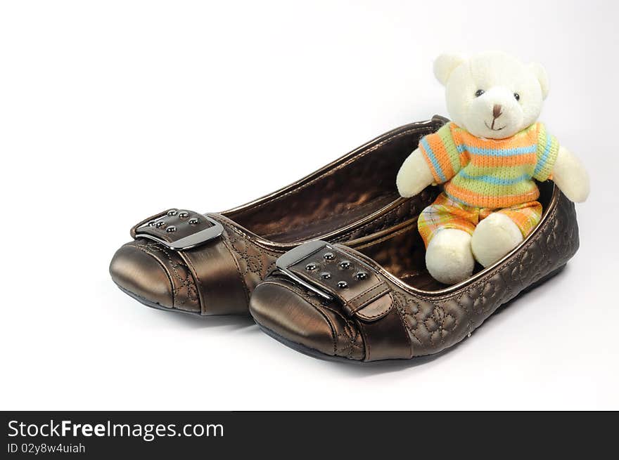 Brown casual shoes for woman and Teddy bear. Brown casual shoes for woman and Teddy bear.