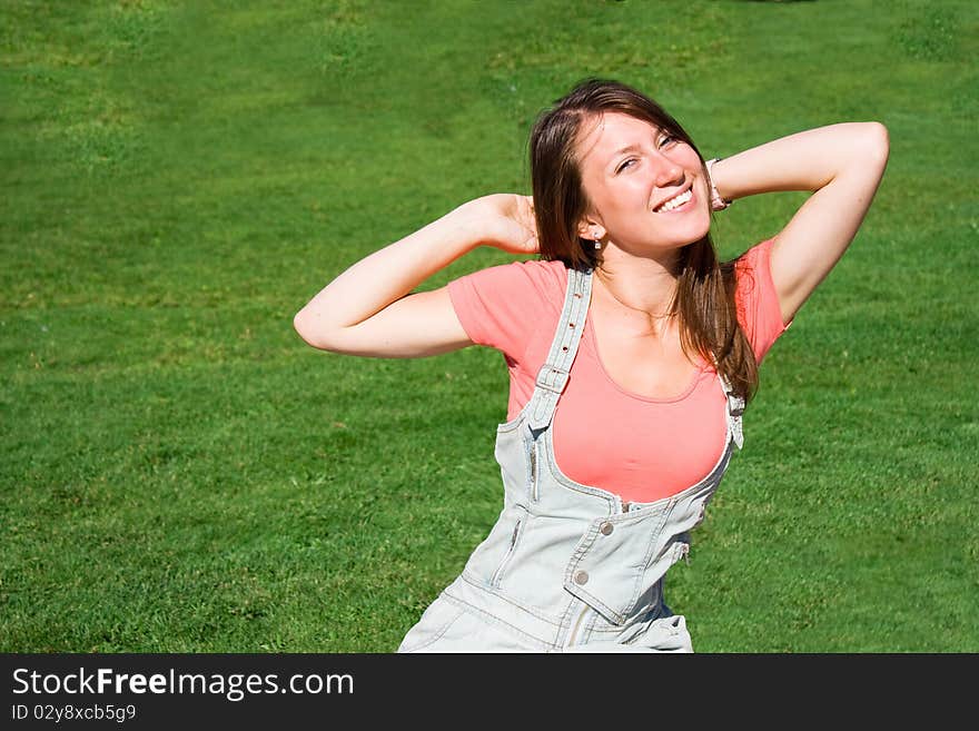 Beautiful Young Student On The  Green Lawn