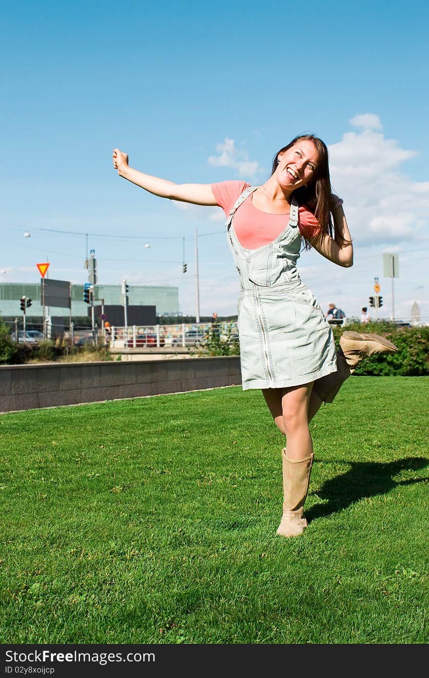 Beautiful Young Student On The Green Lawn