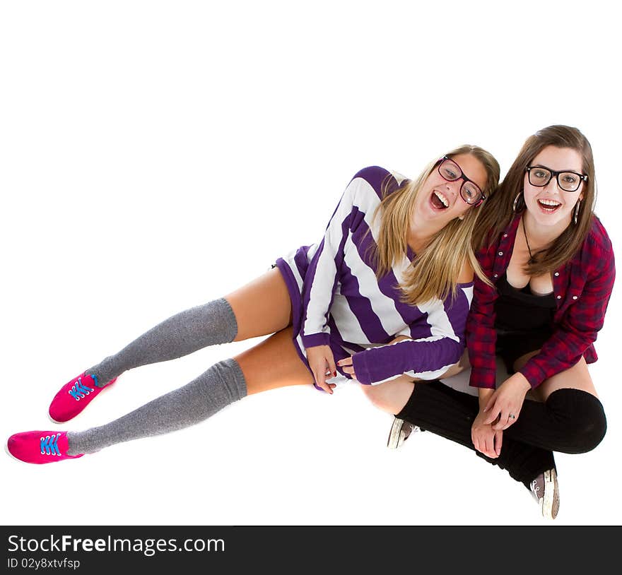 Young trendy teenagers in a nerd / geek style. Isolated over white background.