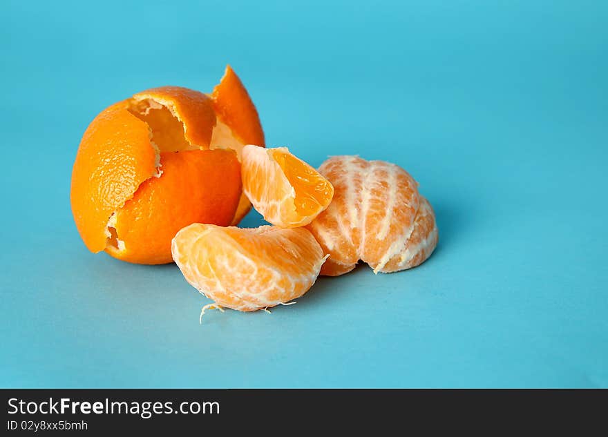 Peeled Orange On Blue Background