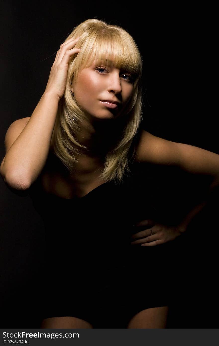 Girl on a black background in studio