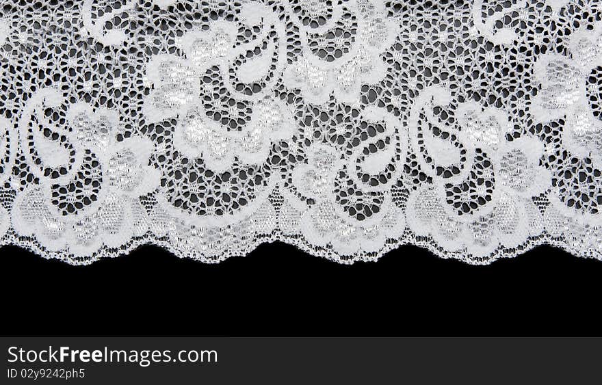 White lace with pattern in the manner of flower on black background