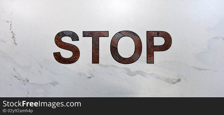 Inscription stop in aeroport on light marble. Inscription stop in aeroport on light marble