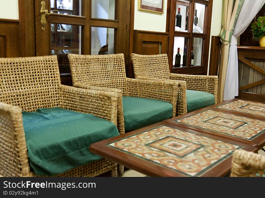 Interior of the restaurant with braided chair and tables