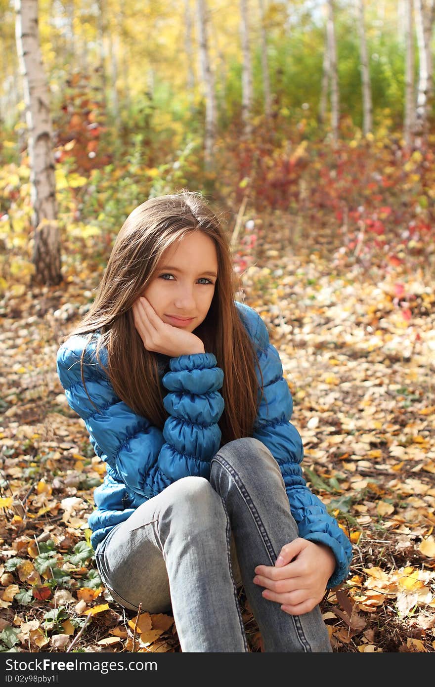 Teenager Girl In The Autumn Forest