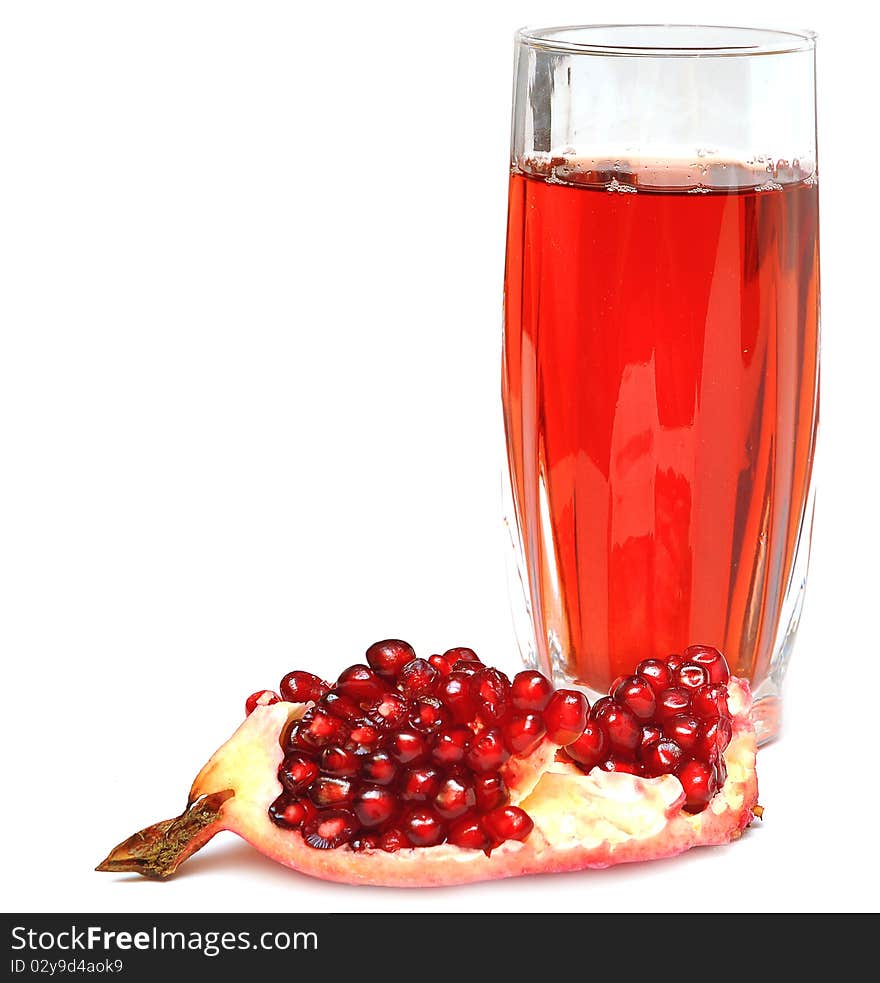 Pomegranate juice in a glass isolated on a white background.