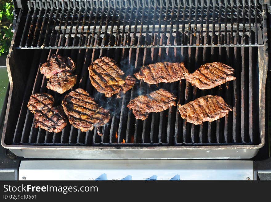 Grill steaks on the grill