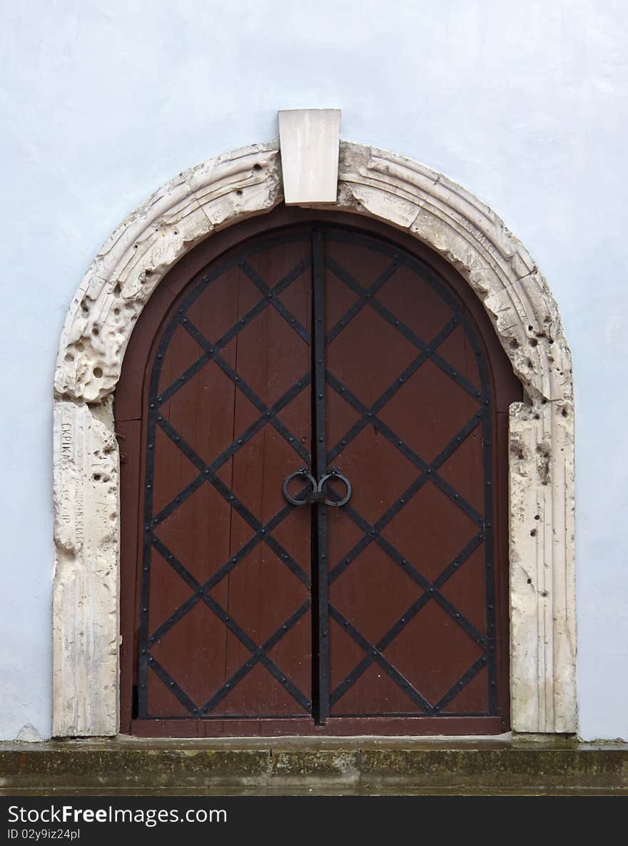 Ancient door in a medieval monastery in Ukraine