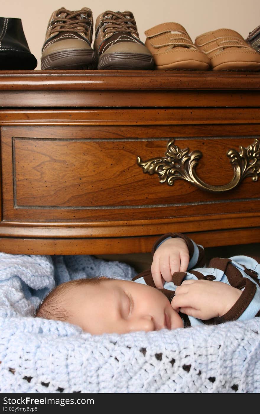 Month old baby boy sleeping in a drawer. Month old baby boy sleeping in a drawer