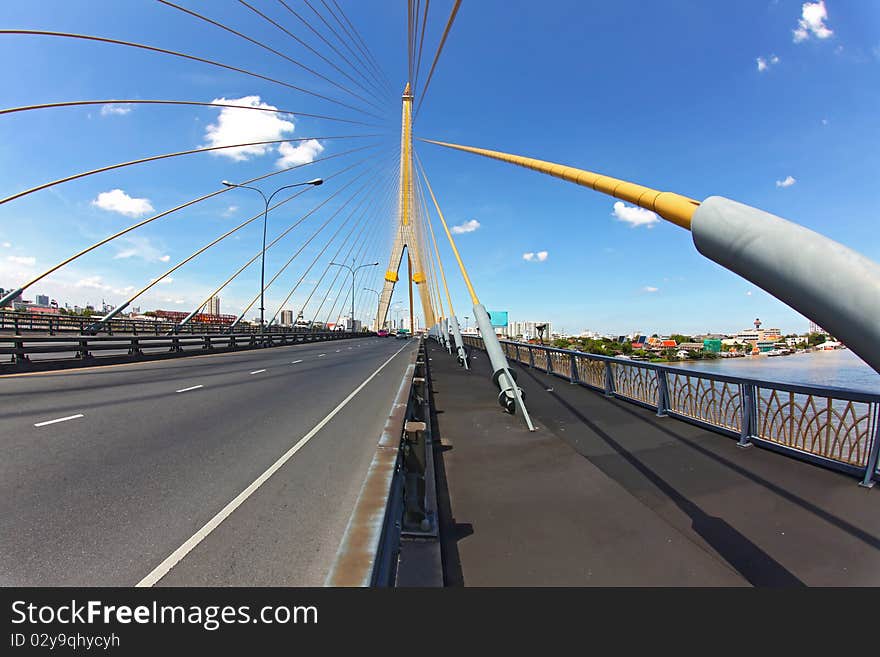 Mega sling Bridge,Rama 8, near Harbor with beautiful sunny in Bangkok, fish eye perspective