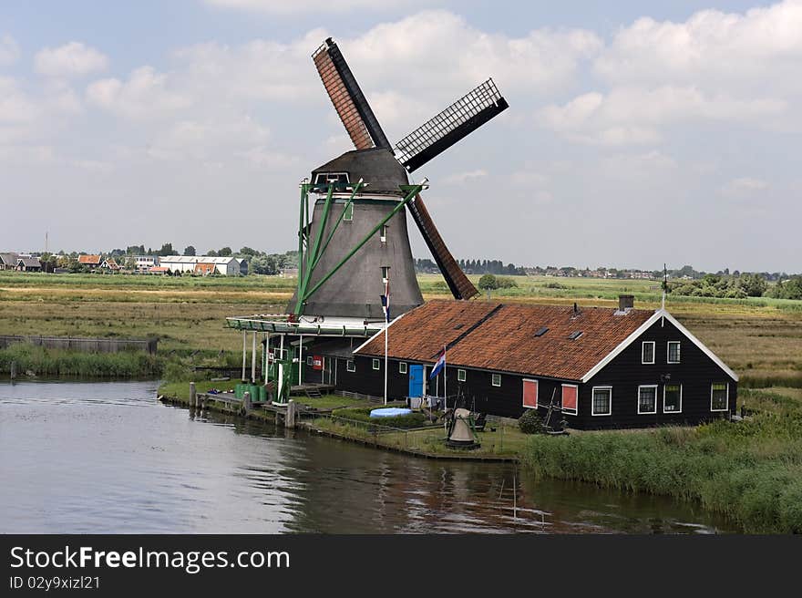 Dutch windmill on a canals edge Netherlands