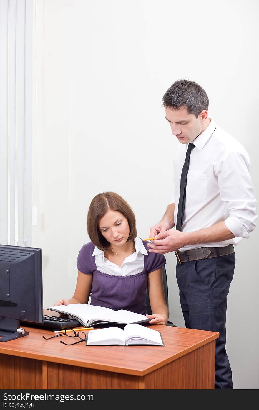 Office workers posing for camera near table