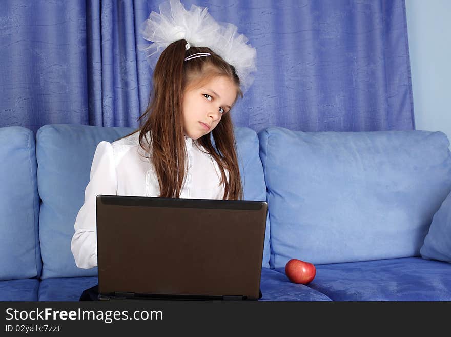 Girl With Laptop And Red Apple