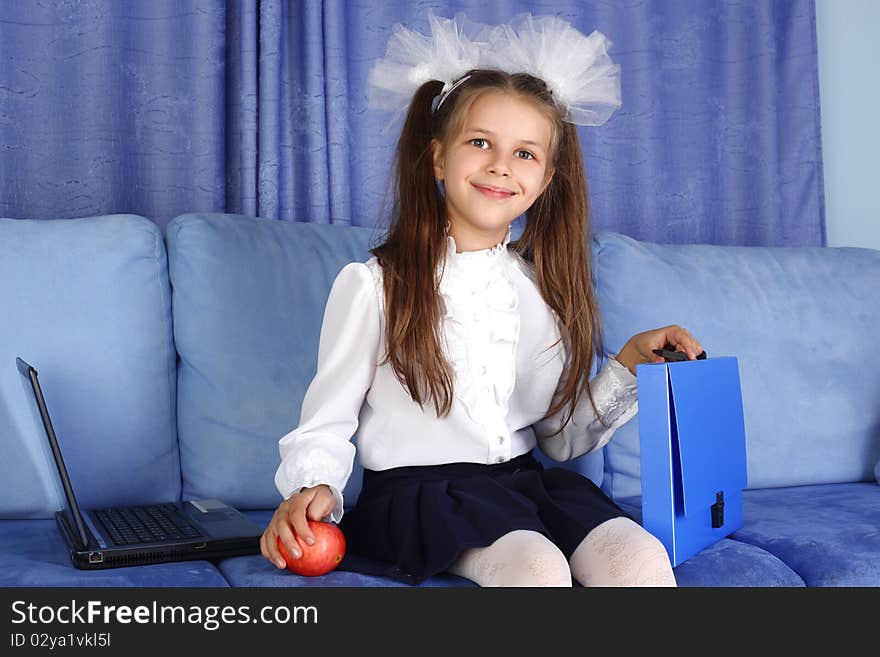 Schoolgirl girl with laptop, backpack