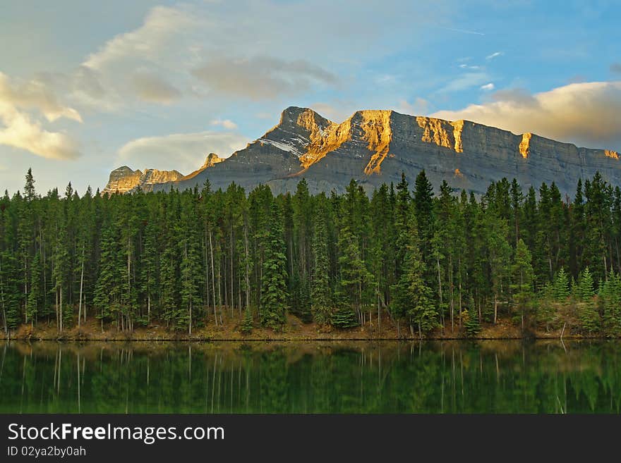 A dawn sunrise on Mt. Rundle as seen from Johnson Lake. Banff National Park, Alberta, Canada. A dawn sunrise on Mt. Rundle as seen from Johnson Lake. Banff National Park, Alberta, Canada