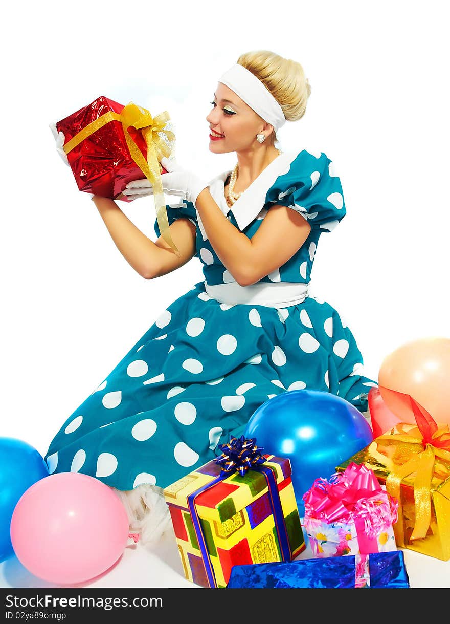 Young woman with colorful gifts isolated on a white background