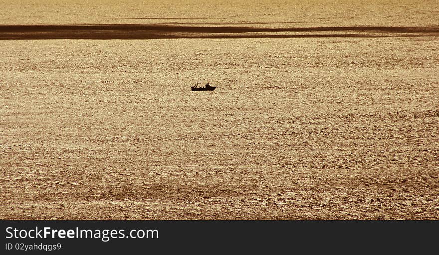 Fishing boat in the distance