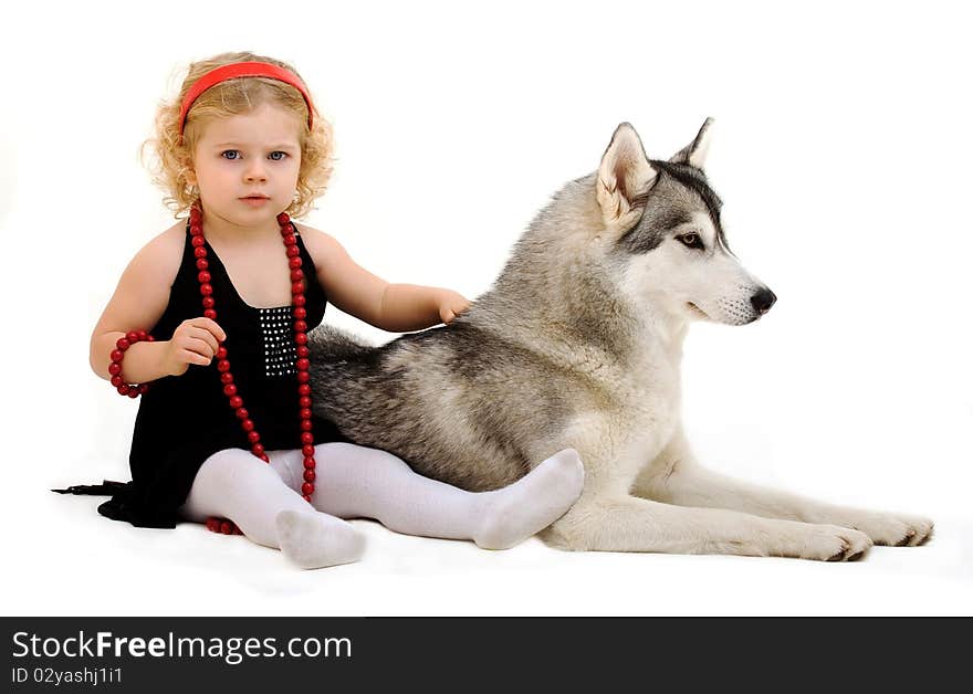 Child playing with dog isolated