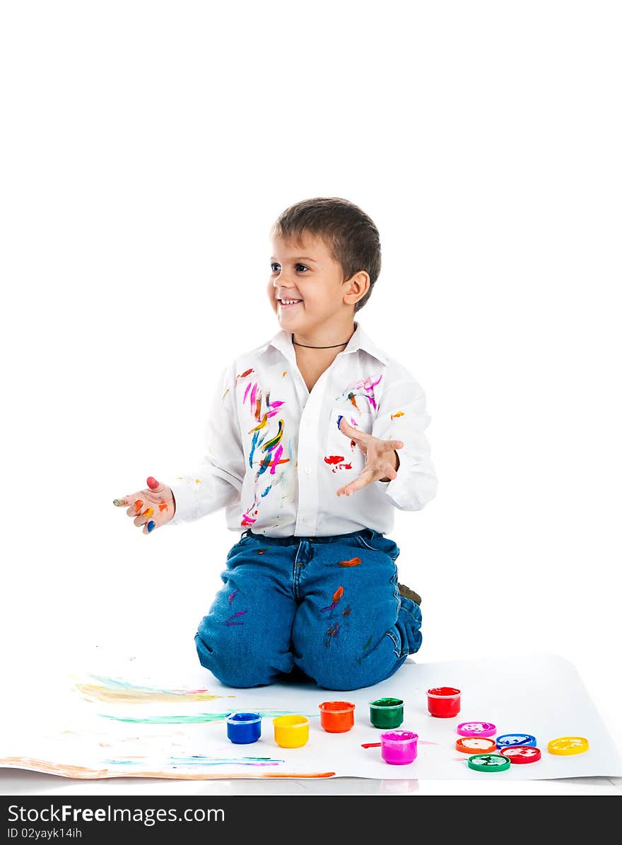 Adorable 3 year old boy covered in bright paint. Adorable 3 year old boy covered in bright paint.