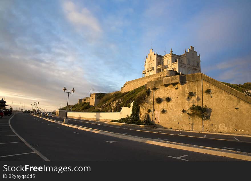 Sunset and the golden hour view of the old marble cottage Palacete Almeida Araujo a classic landmark in the Lagoa de Obidos lagoon beach, at Foz do Arelho, Silver Coast, Portugal. Sunset and the golden hour view of the old marble cottage Palacete Almeida Araujo a classic landmark in the Lagoa de Obidos lagoon beach, at Foz do Arelho, Silver Coast, Portugal