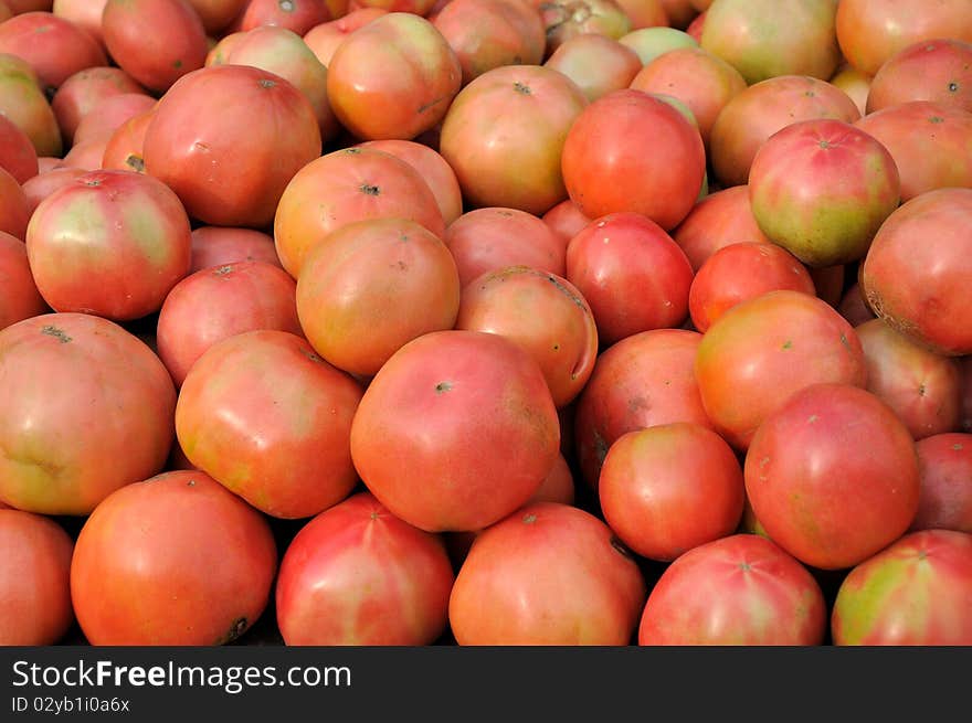 Raw tomato stacking for selling in super market, shown as original, healthy and fresh vegetable. Raw tomato stacking for selling in super market, shown as original, healthy and fresh vegetable.